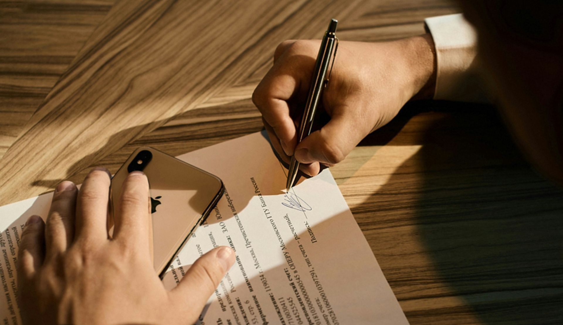 person writing on white paper
